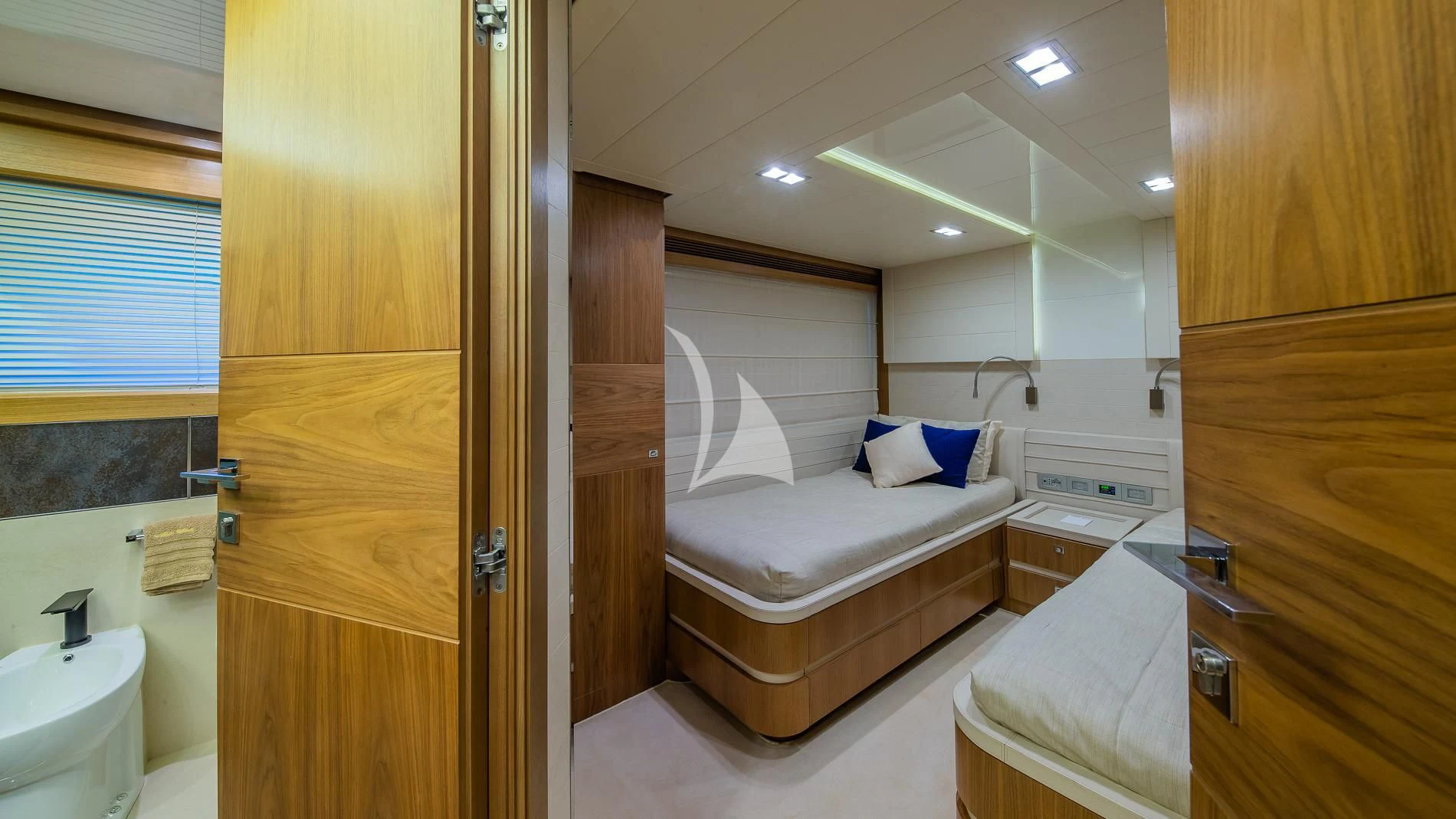a bedroom with a bed and a sink aboard ONE AND ONLY Yacht for Sale