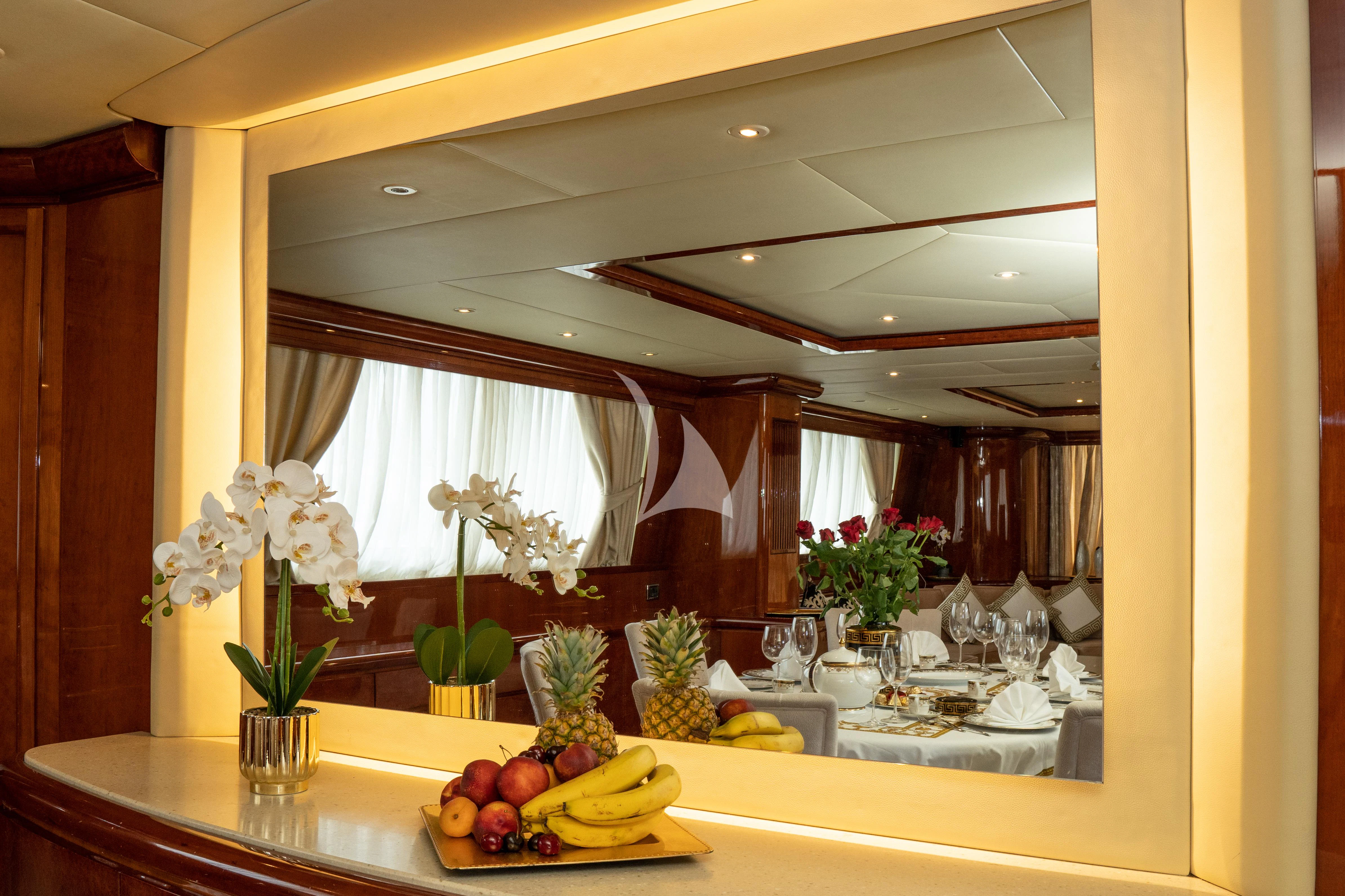 a table with fruits and flowers aboard FALCON ISLAND Yacht for Sale