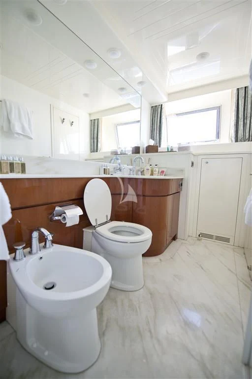 a bathroom with a sink and toilet aboard FALCON ISLAND Yacht for Sale