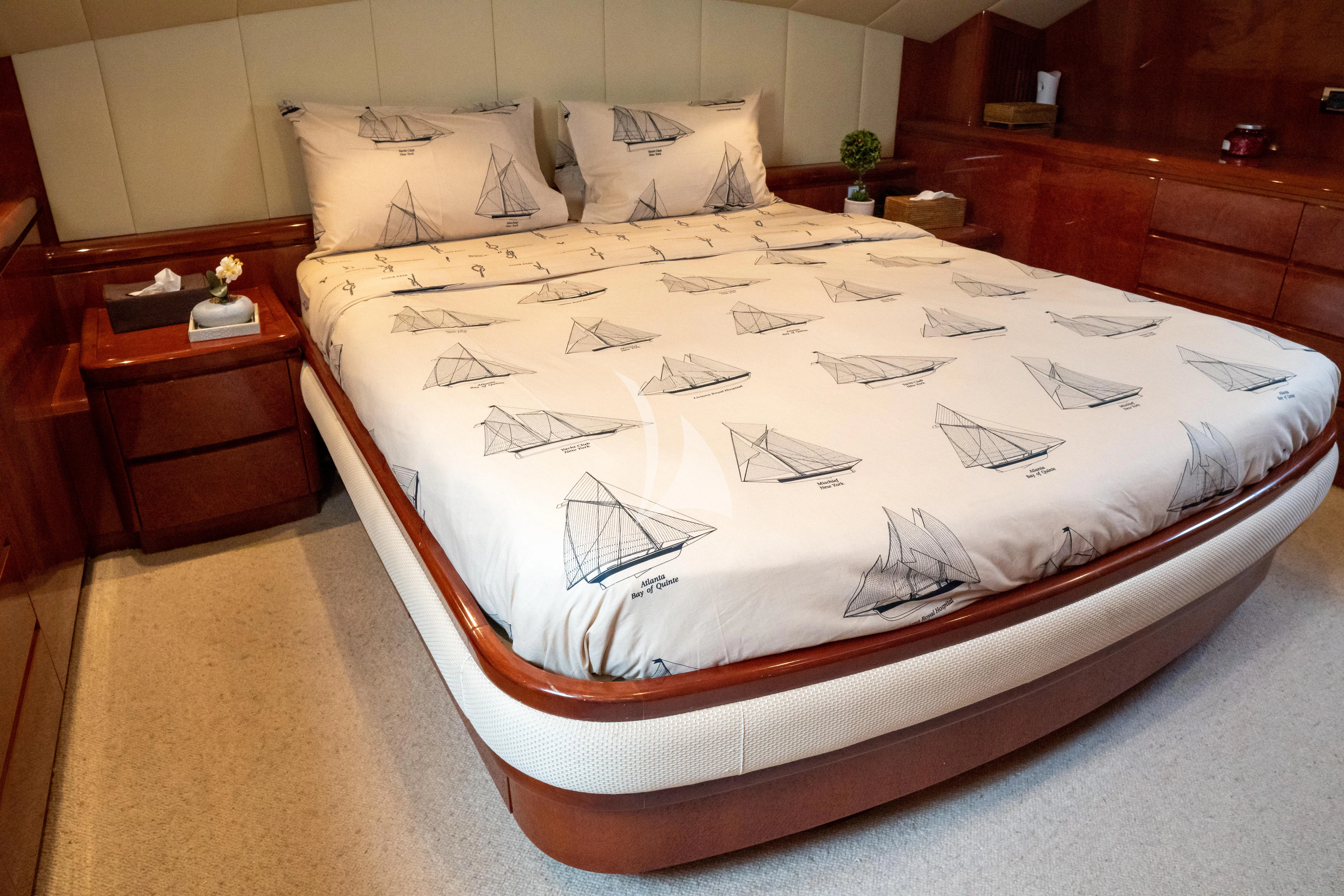 a bed with white sheets aboard FALCON ISLAND Yacht for Sale