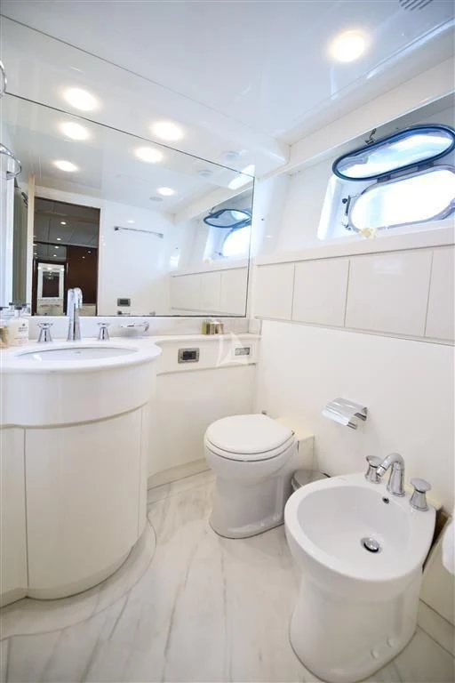a bathroom with a large mirror aboard FALCON ISLAND Yacht for Sale