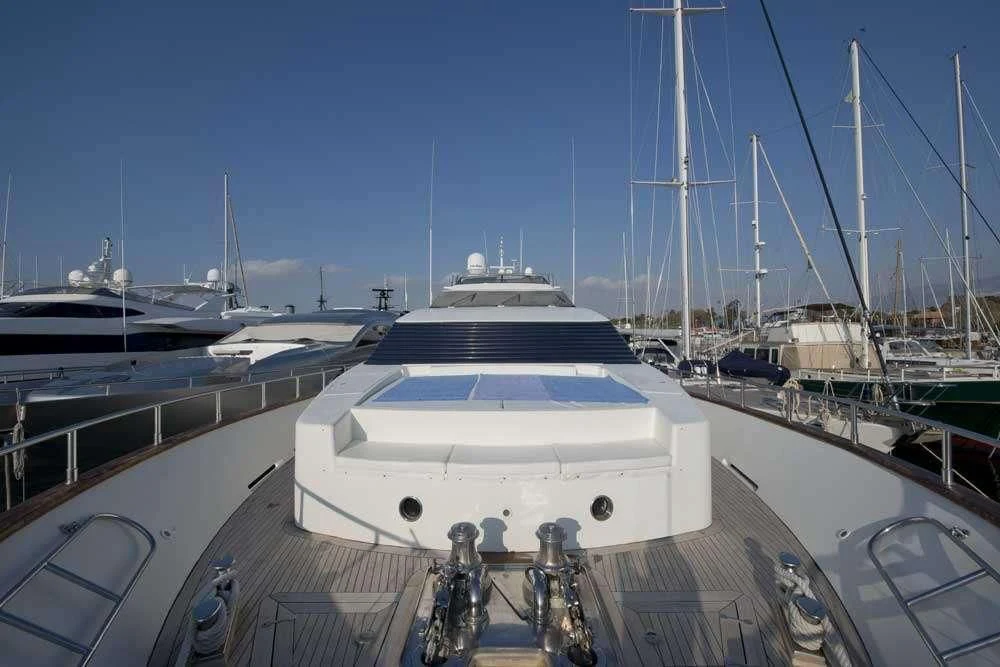 a large white boat in a harbor aboard FALCON ISLAND Yacht for Sale