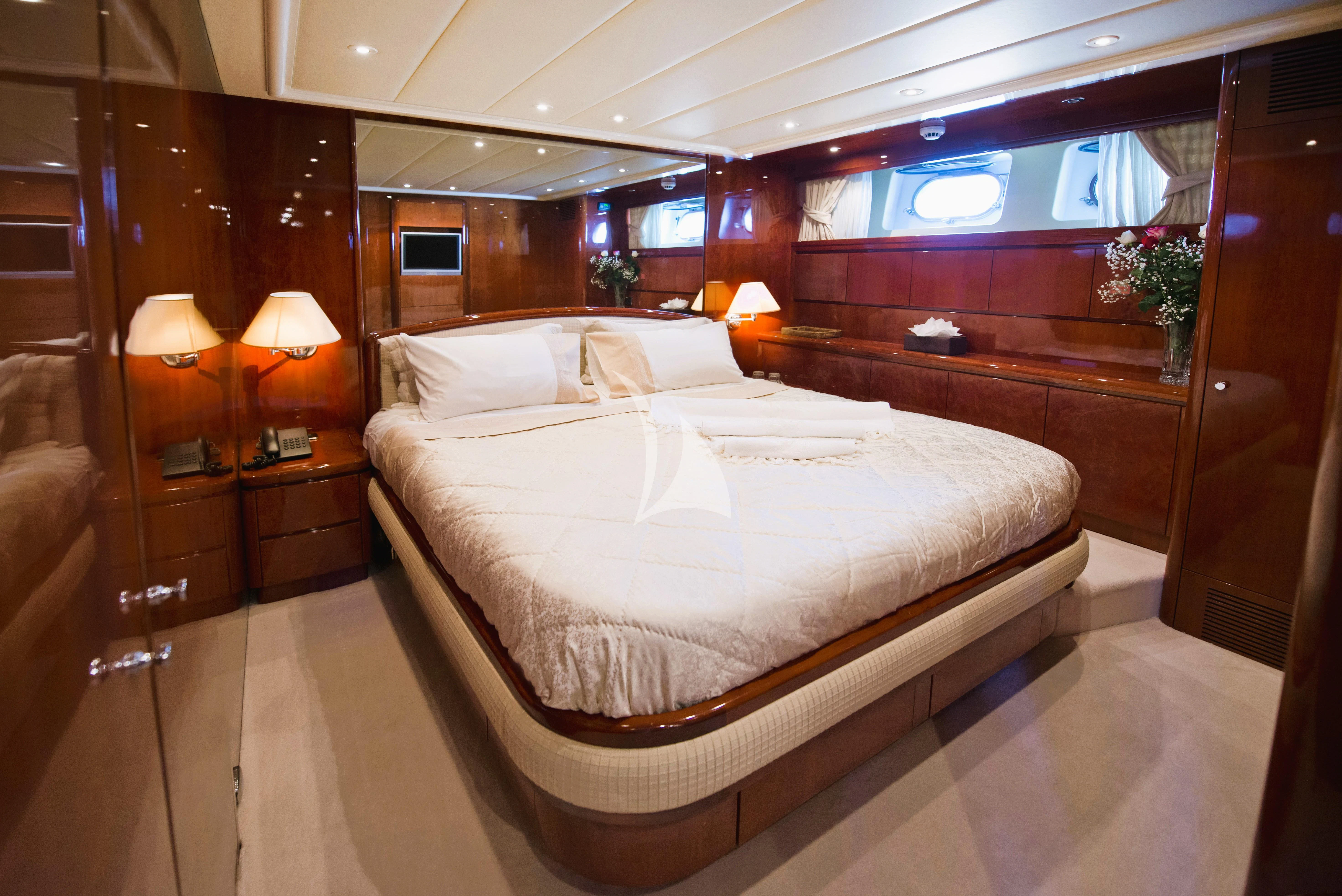a bed in a room aboard FALCON ISLAND Yacht for Sale