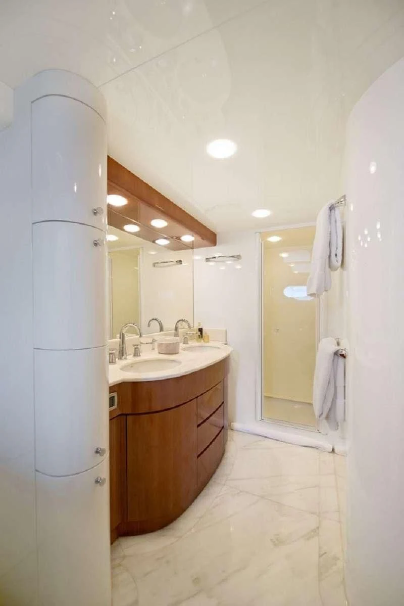 a bathroom with a sink and a mirror aboard FALCON ISLAND Yacht for Sale