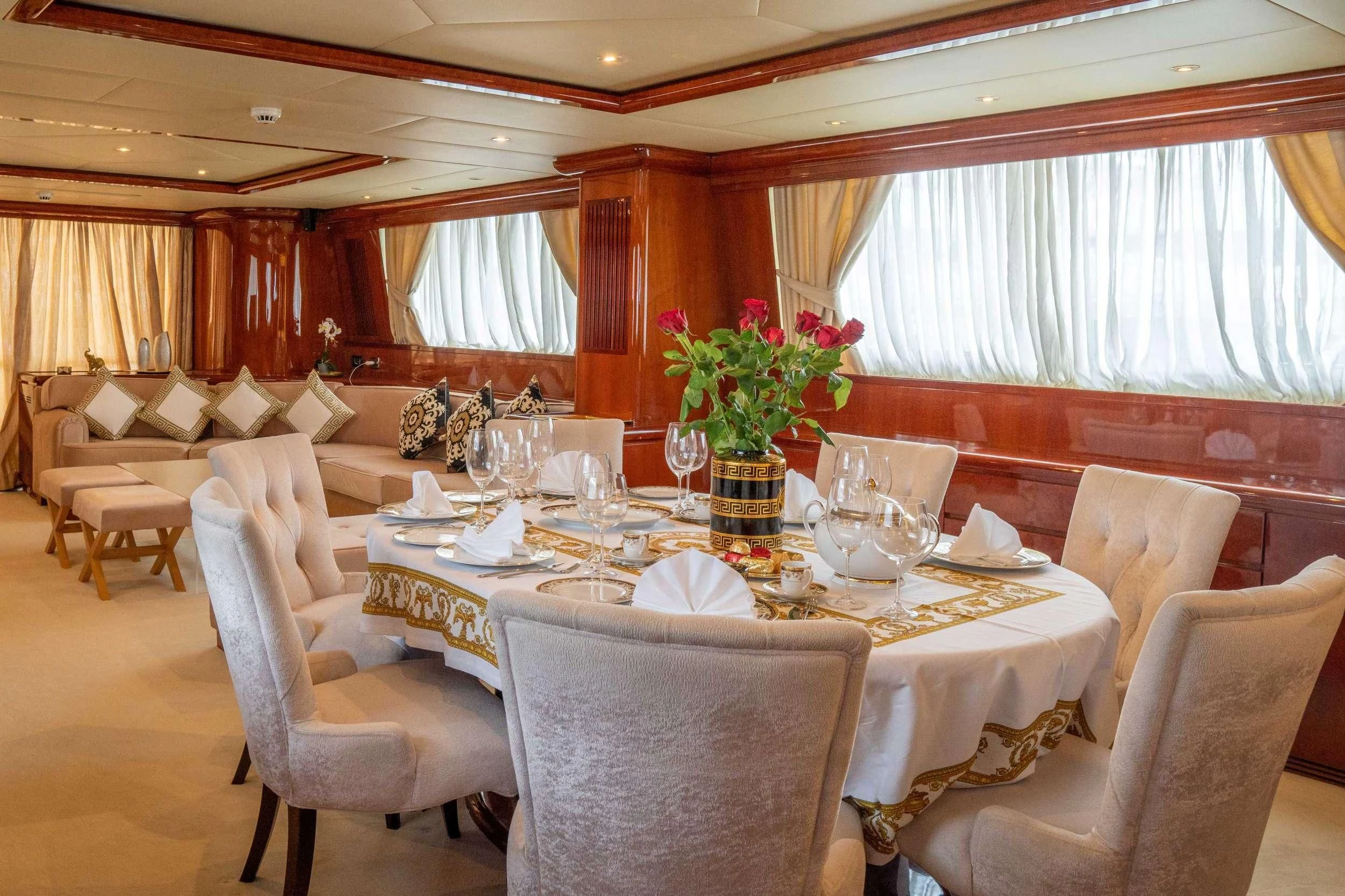 a dining room with a table set aboard FALCON ISLAND Yacht for Sale