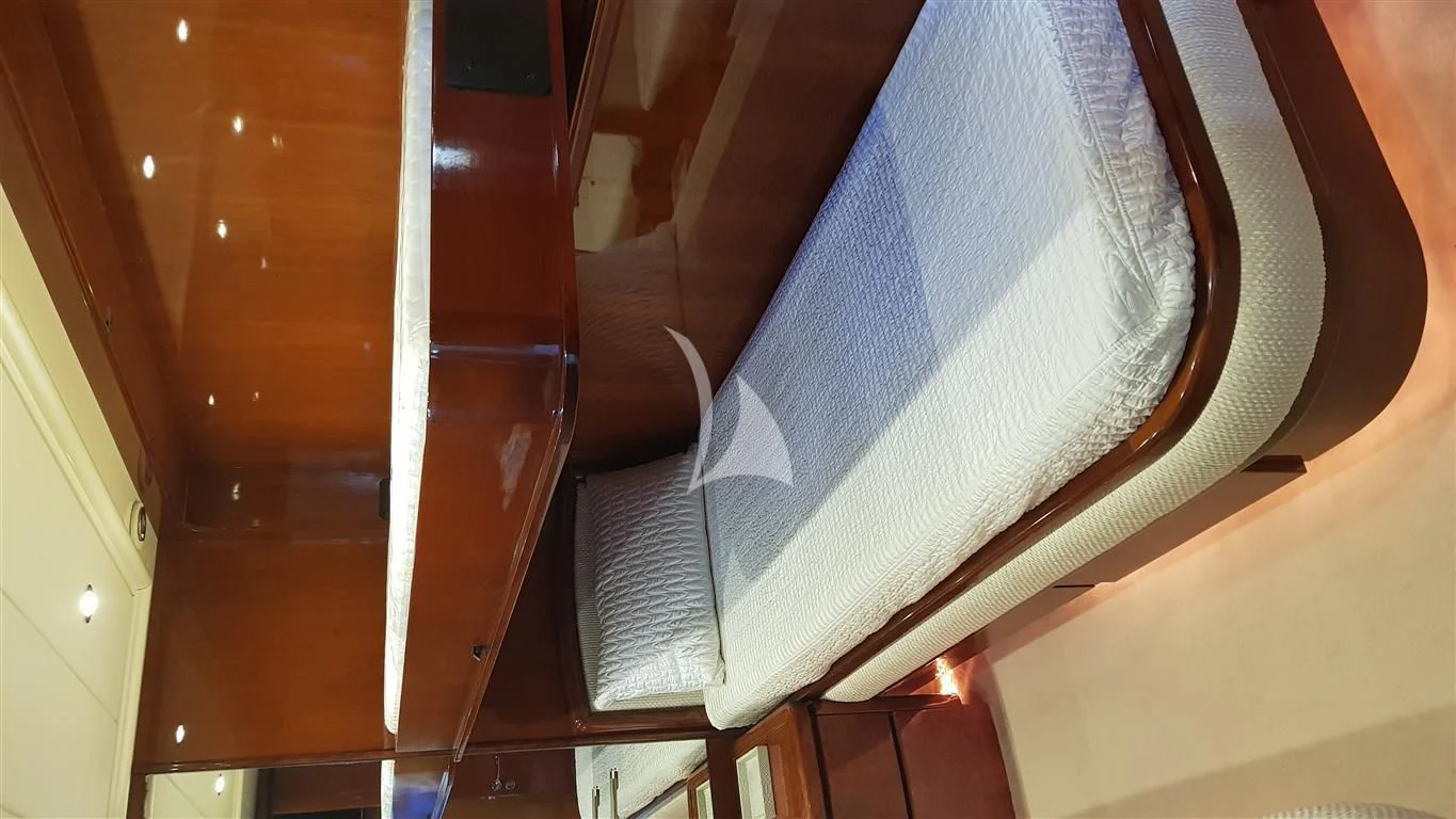 a white and grey striped towel on a door aboard FALCON ISLAND Yacht for Sale