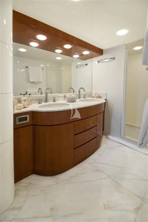 a bathroom with a large mirror aboard FALCON ISLAND Yacht for Sale