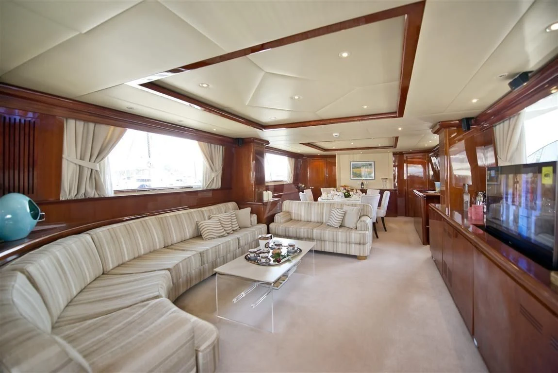 a living room with a large window aboard FALCON ISLAND Yacht for Sale
