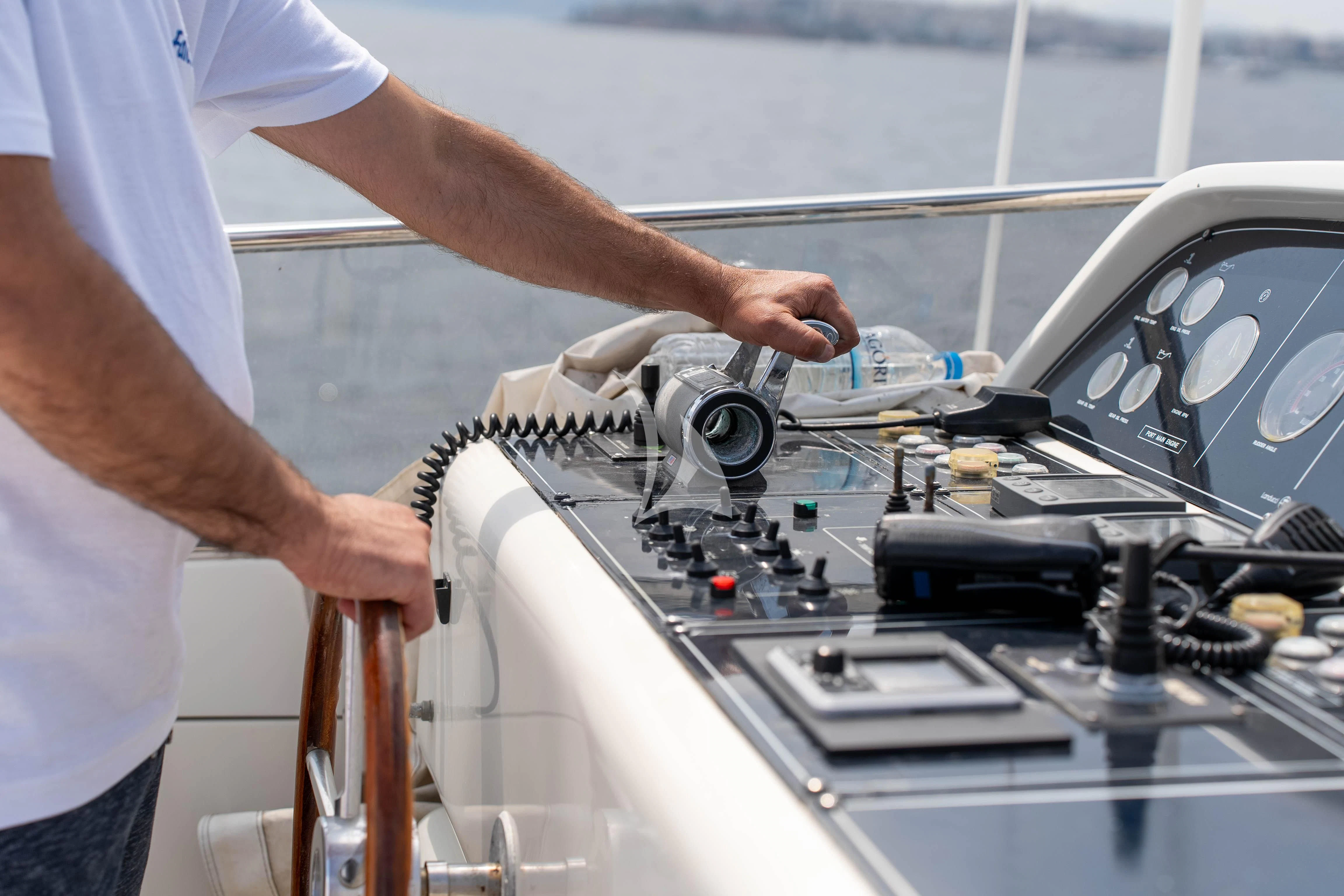 a man operating a machine aboard FALCON ISLAND Yacht for Sale
