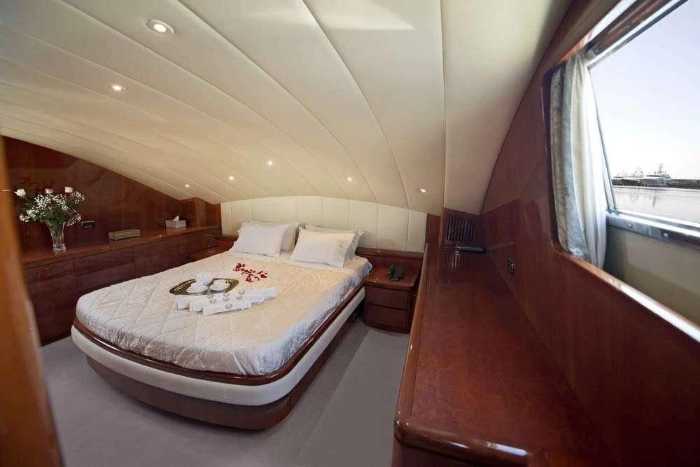 a bed in a room aboard FALCON ISLAND Yacht for Sale
