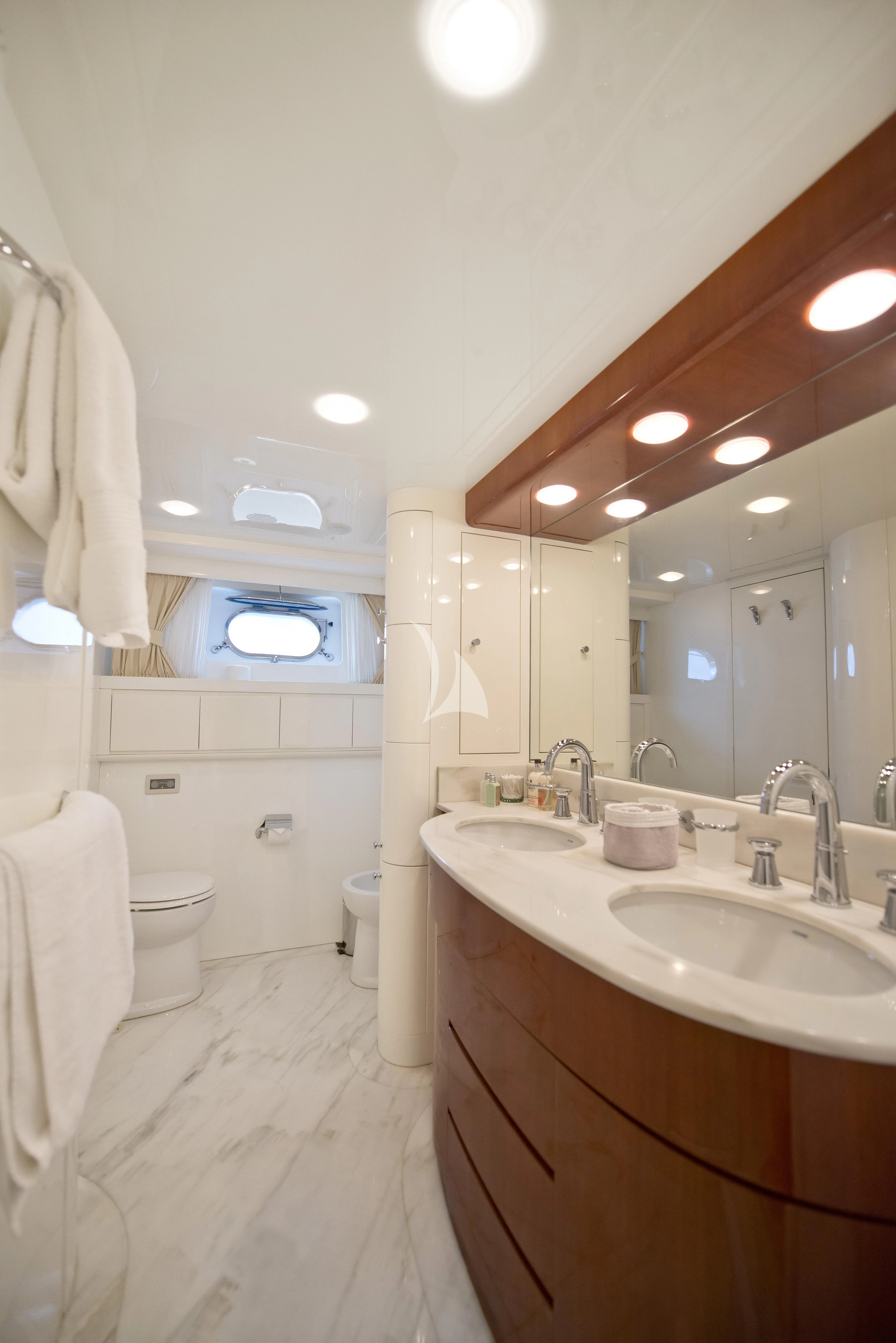 a bathroom with a large mirror aboard FALCON ISLAND Yacht for Sale