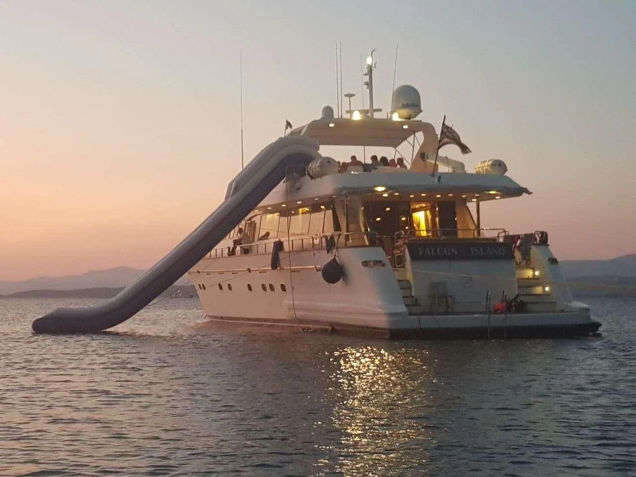a large ship in the water aboard FALCON ISLAND Yacht for Sale