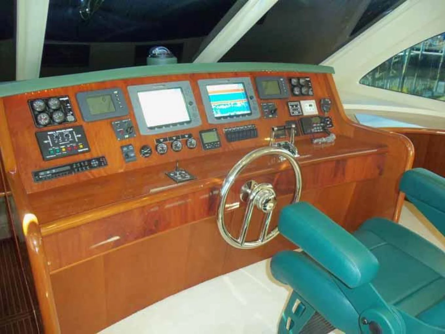 a wooden paneled cockpit with a steering wheel and a steering wheel aboard DOLCE VITA Yacht for Sale