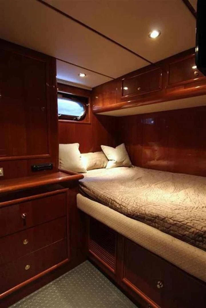 a bed in a room aboard DOLCE VITA Yacht for Sale