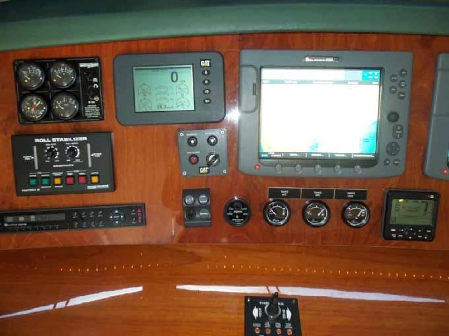 a wooden table with a radio and other devices on it aboard DOLCE VITA Yacht for Sale