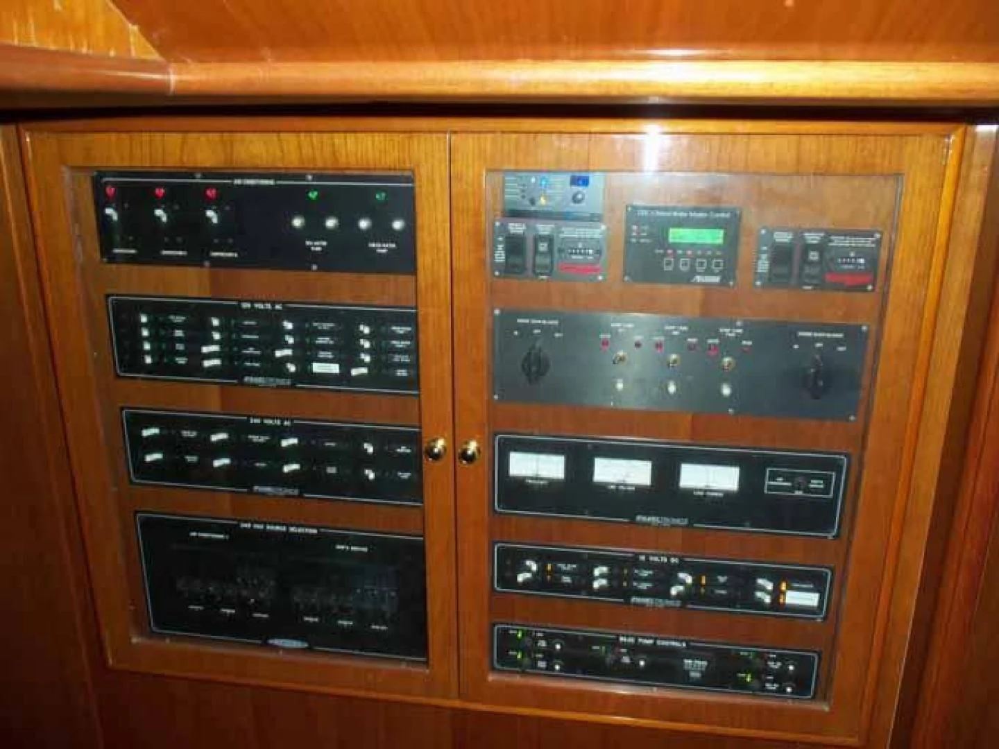 a cabinet with many buttons aboard DOLCE VITA Yacht for Sale