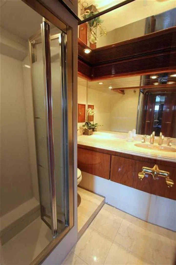 a bathroom with a large mirror aboard DOLCE VITA Yacht for Sale