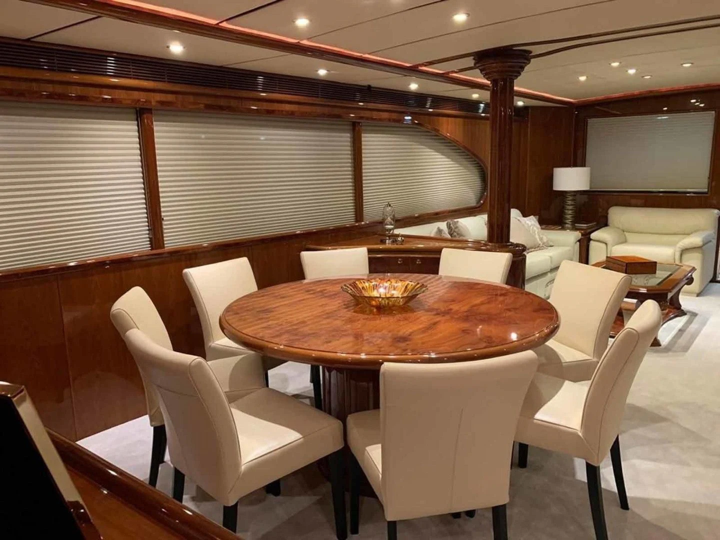 a room with a table and chairs aboard DOLCE VITA Yacht for Sale
