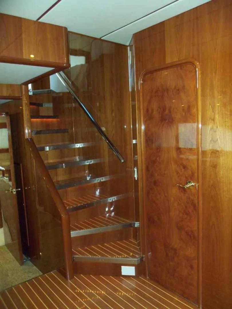 a wooden staircase in a house aboard DOLCE VITA Yacht for Sale
