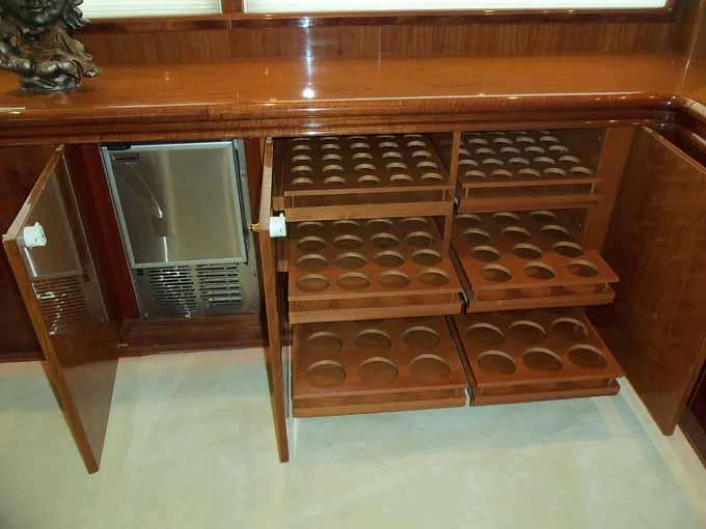 a wooden shelf with drawers aboard DOLCE VITA Yacht for Sale