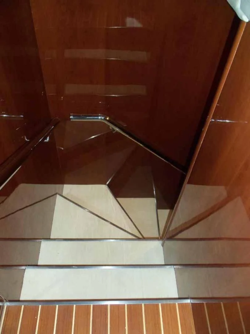 a tiled floor with a metal railing aboard DOLCE VITA Yacht for Sale