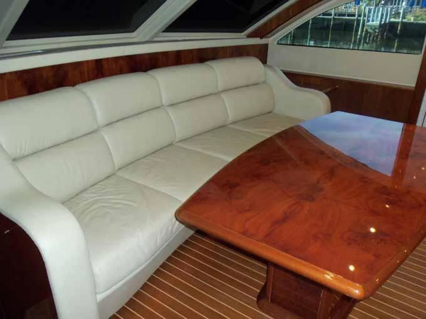a couch with a table on it aboard DOLCE VITA Yacht for Sale
