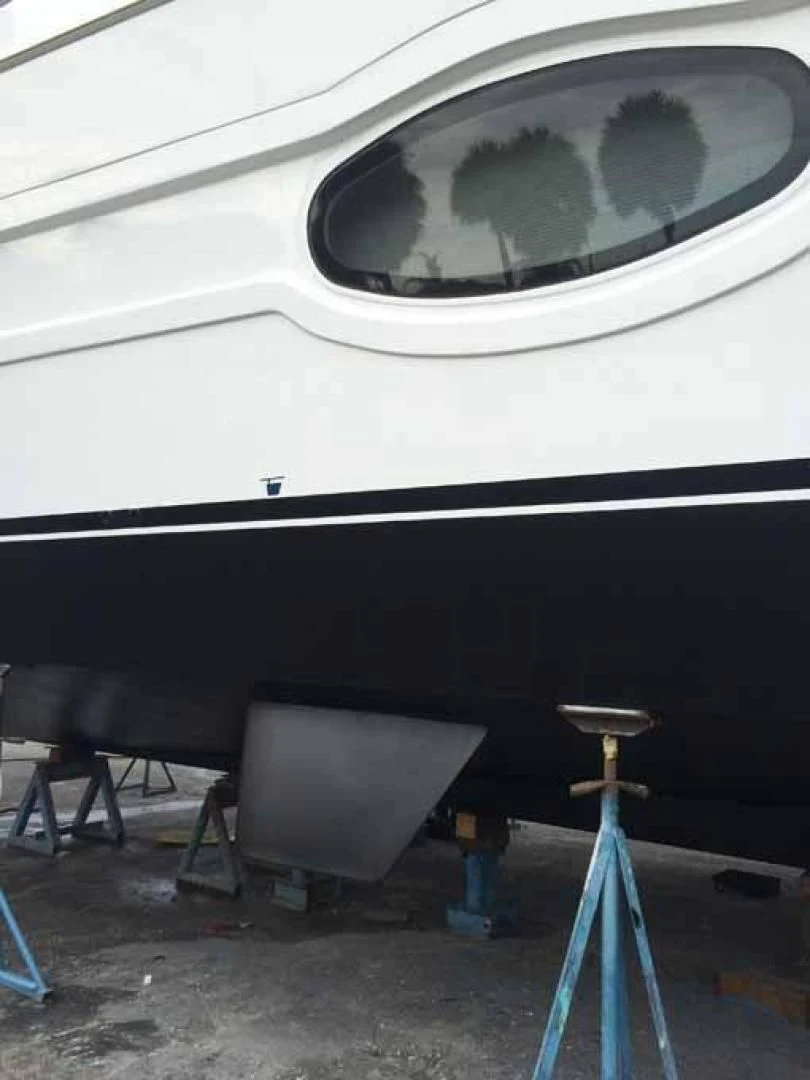 a large white airplane with a satellite dish on the ground aboard DOLCE VITA Yacht for Sale