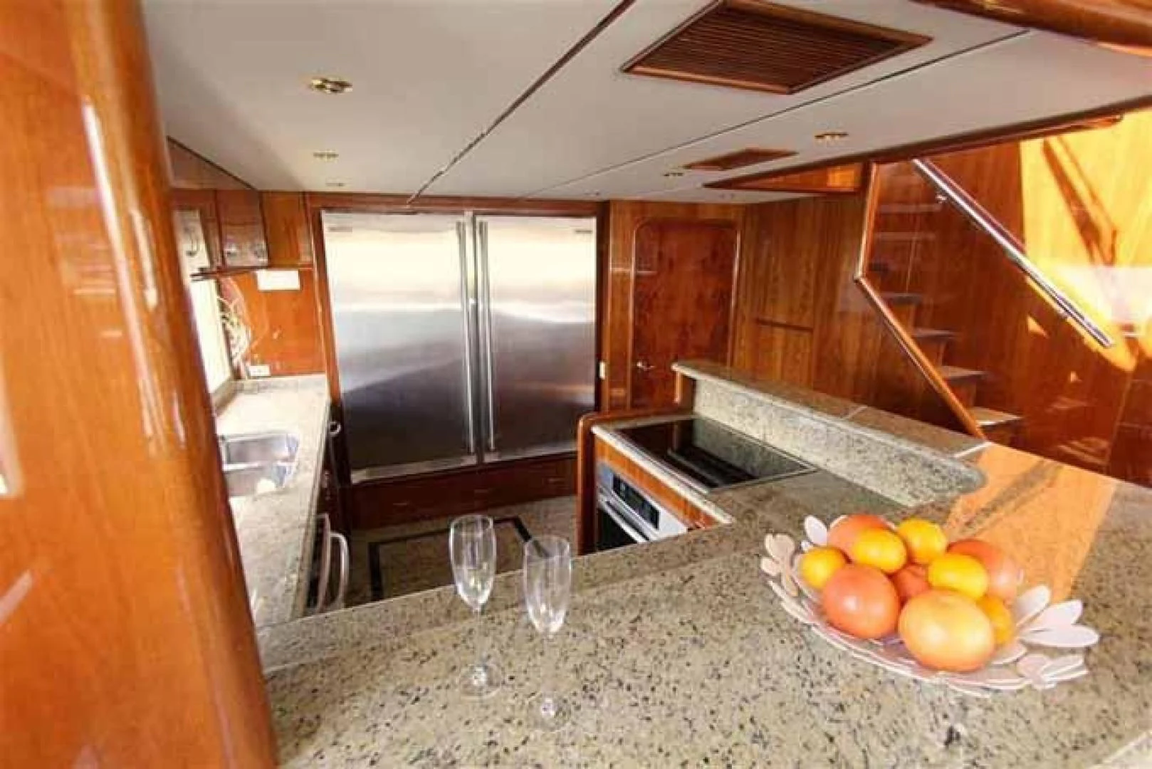 a kitchen with marble counters aboard DOLCE VITA Yacht for Sale