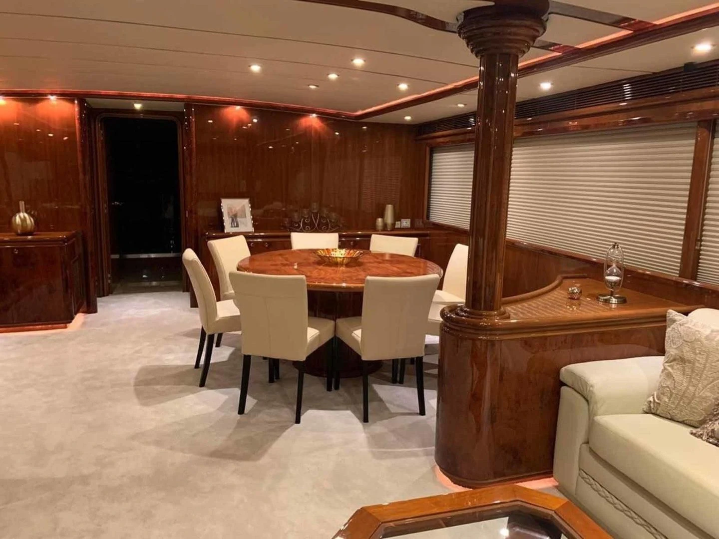 a room with a table and chairs aboard DOLCE VITA Yacht for Sale