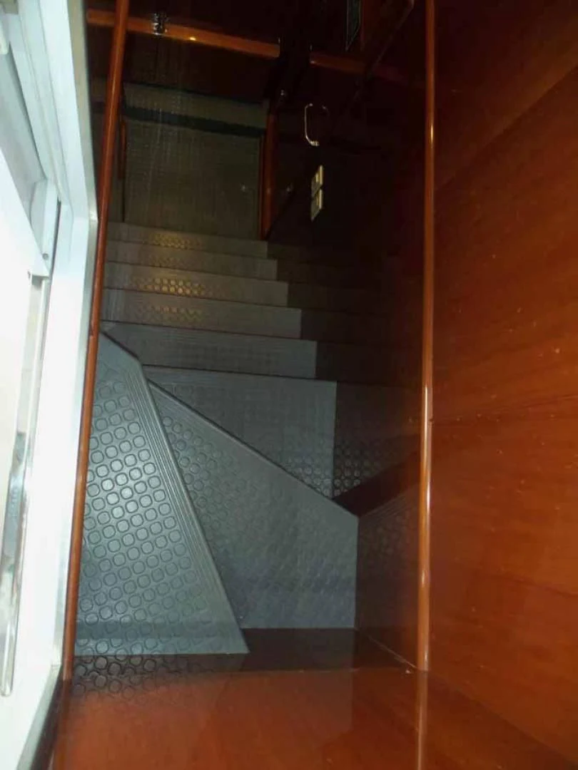 a staircase with a glass door aboard DOLCE VITA Yacht for Sale