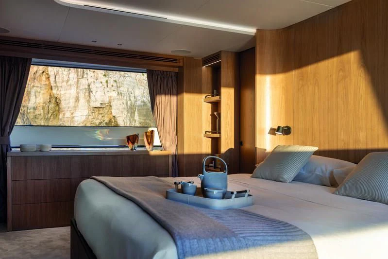 a bed with a tray on it aboard SEAESTA Yacht for Sale