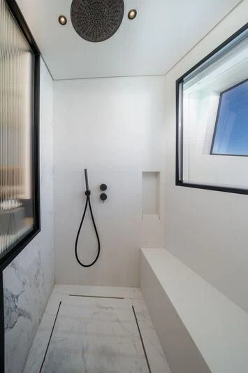 a bathroom with a large shower aboard SEAESTA Yacht for Sale