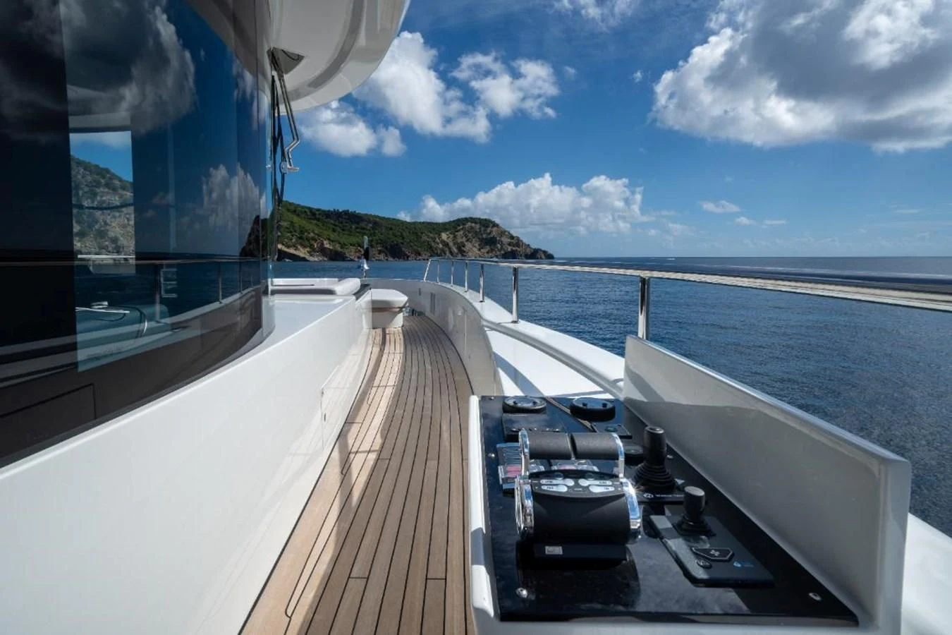 a deck with boats on it and water and land in the background aboard SEAESTA Yacht for Sale