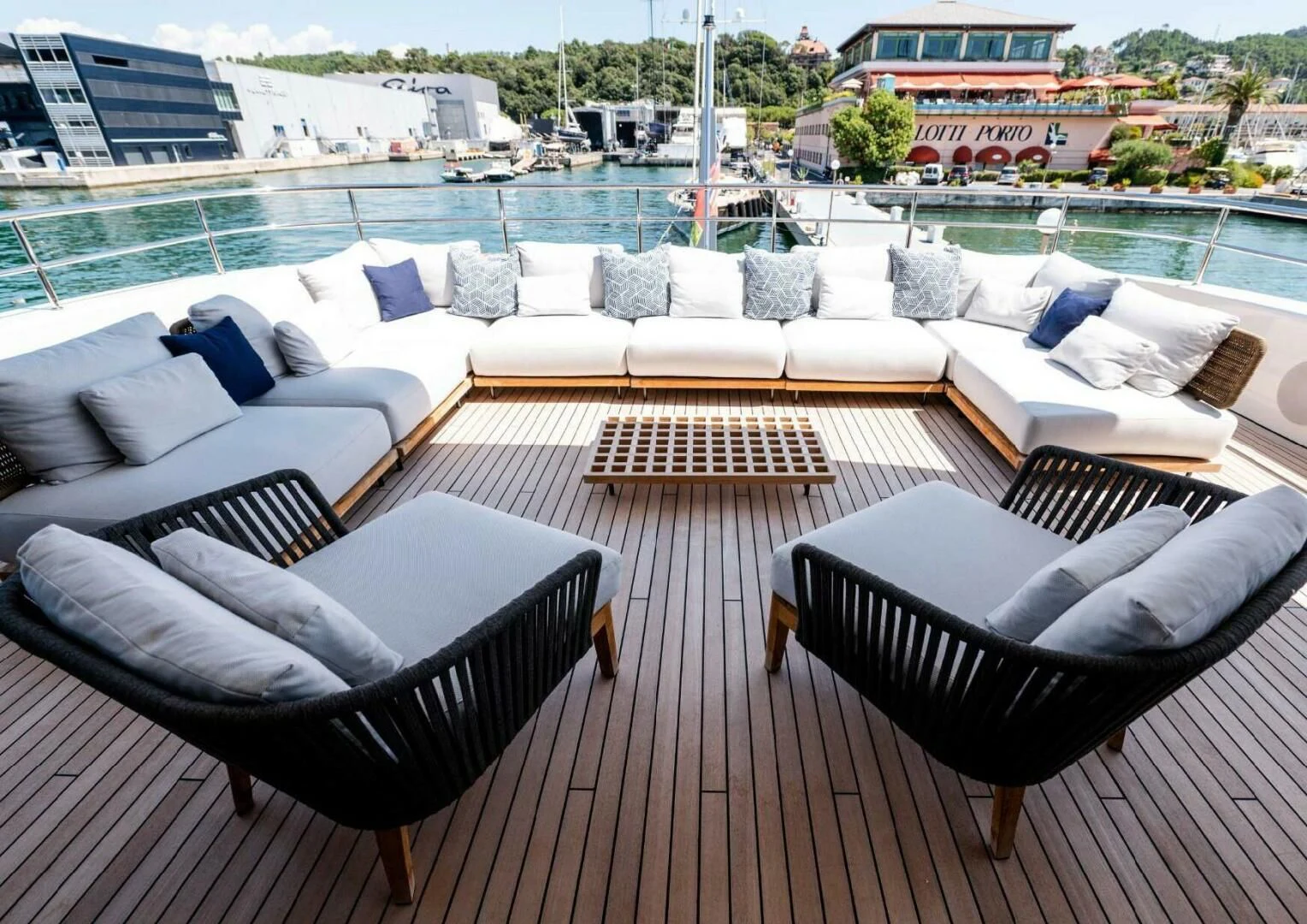 a group of couches in a room with a view of a city aboard SEAESTA Yacht for Sale