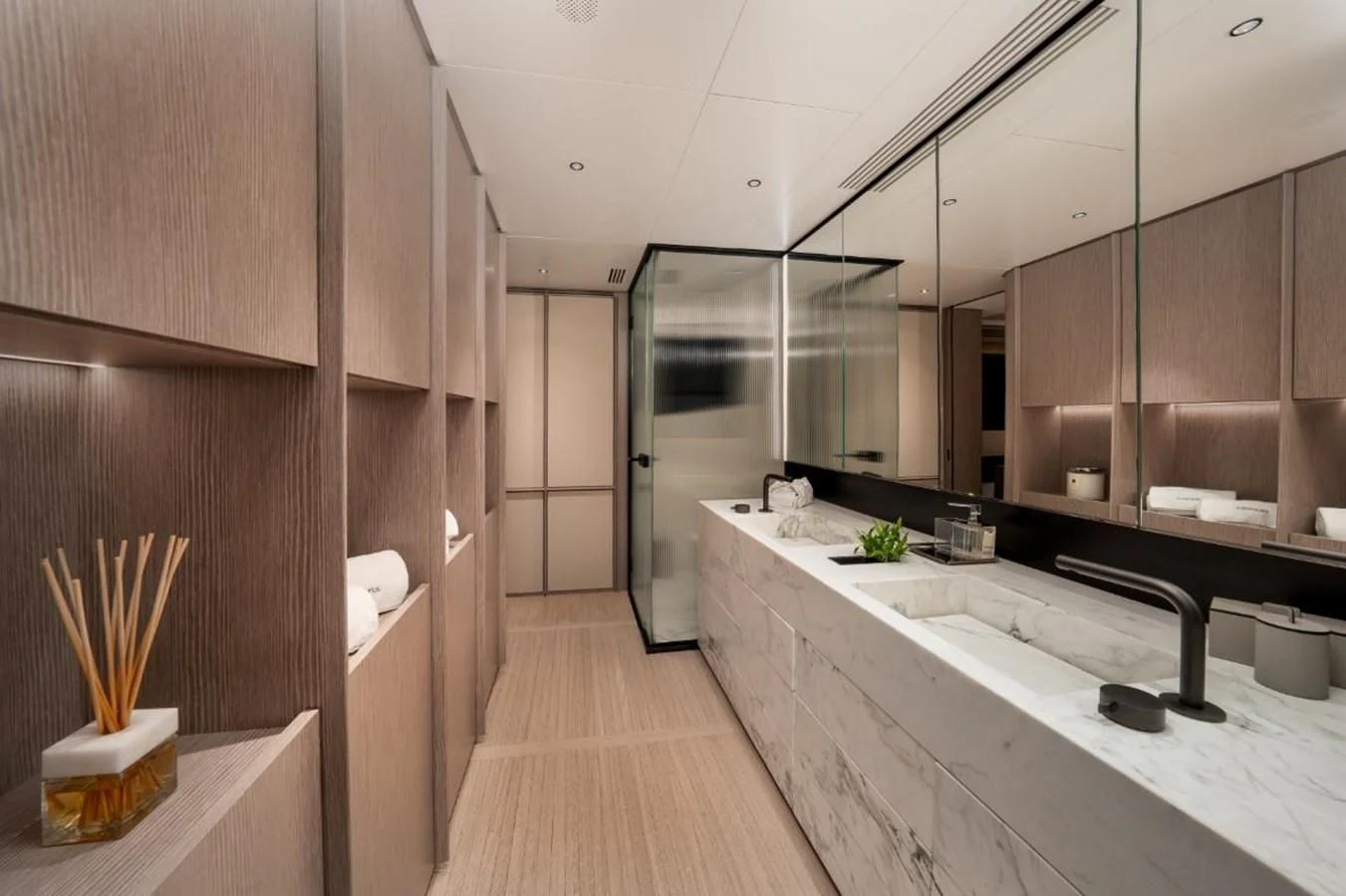 a modern bathroom with a large mirror aboard SEAESTA Yacht for Sale