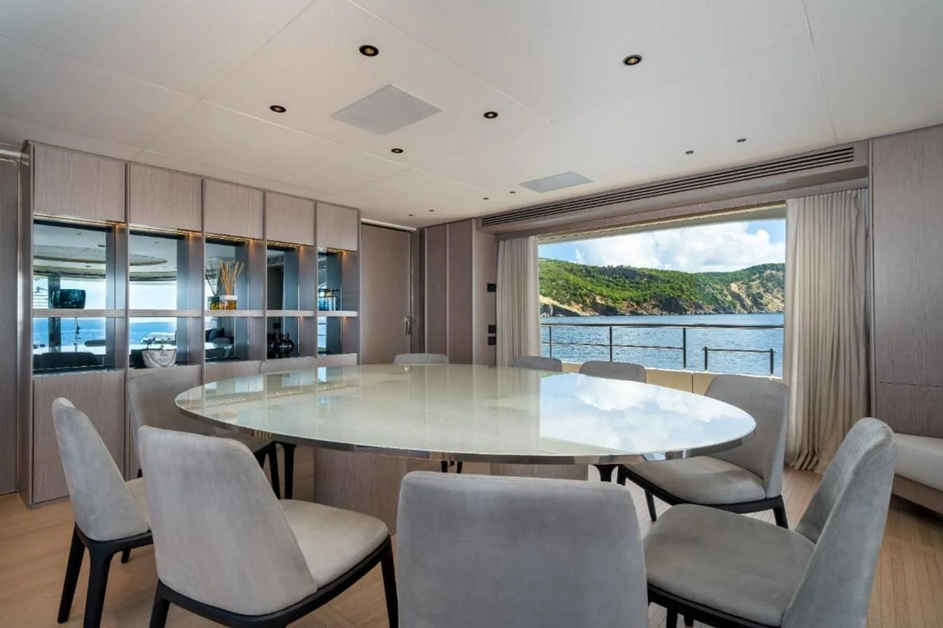 a large dining table in a room aboard SEAESTA Yacht for Sale