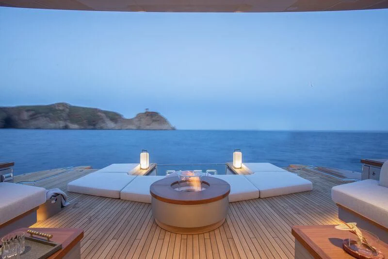 a table with chairs on it by the water aboard SEAESTA Yacht for Sale