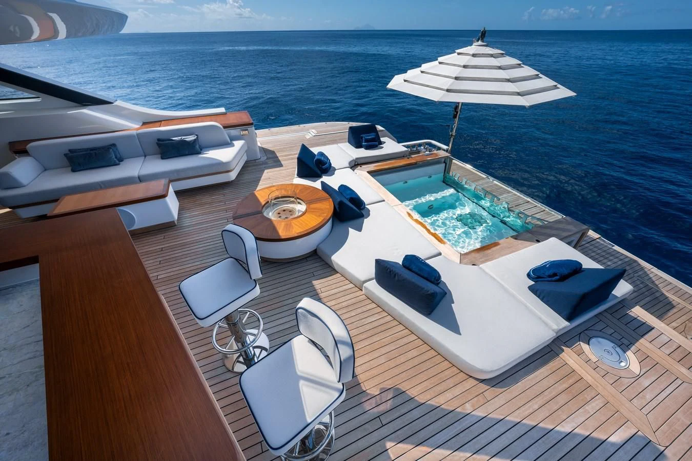 a deck with a boat and chairs on it aboard SEAESTA Yacht for Sale