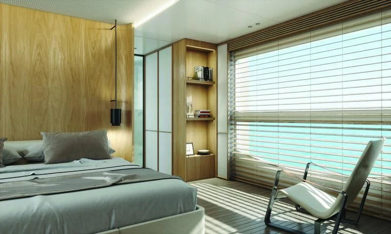 a bedroom with a bed and a window aboard SEAESTA Yacht for Sale