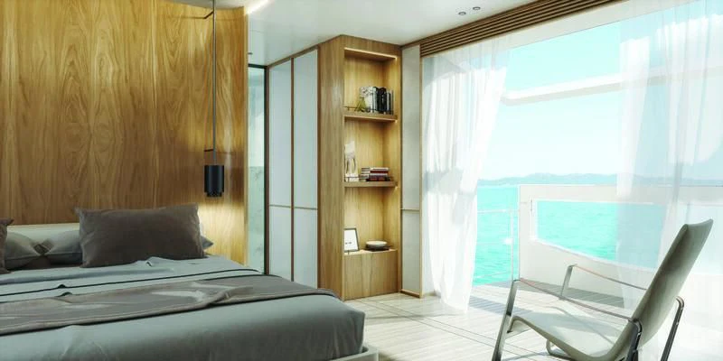 a bedroom with a bed and a desk aboard SEAESTA Yacht for Sale