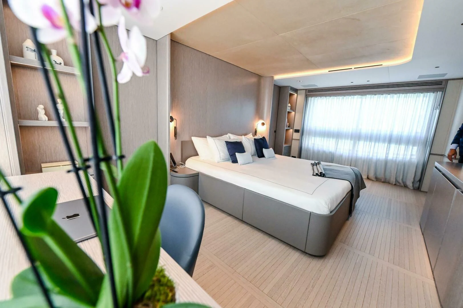 a room with a bed and a chair aboard SEAESTA Yacht for Sale