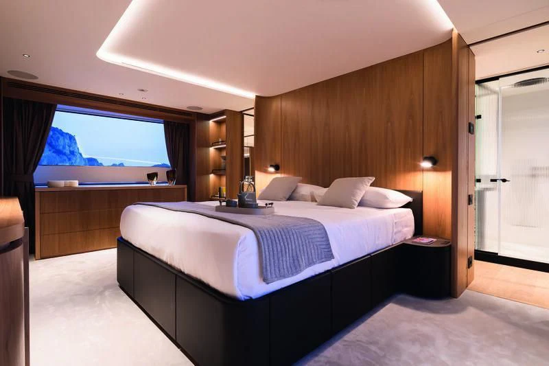 a room with a bed and a window aboard SEAESTA Yacht for Sale