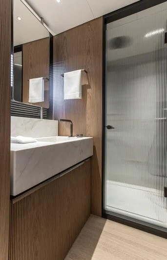 a bathroom with a sink and a shower aboard SEAESTA Yacht for Sale