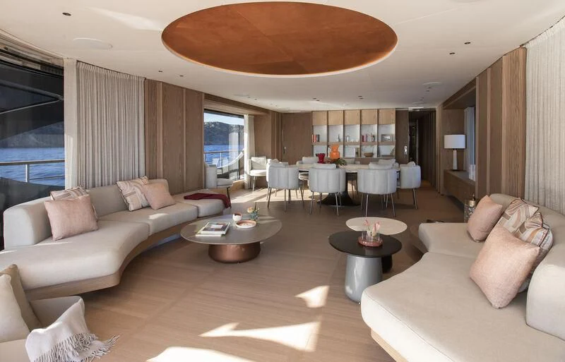 a living room with a couch and a table aboard SEAESTA Yacht for Sale
