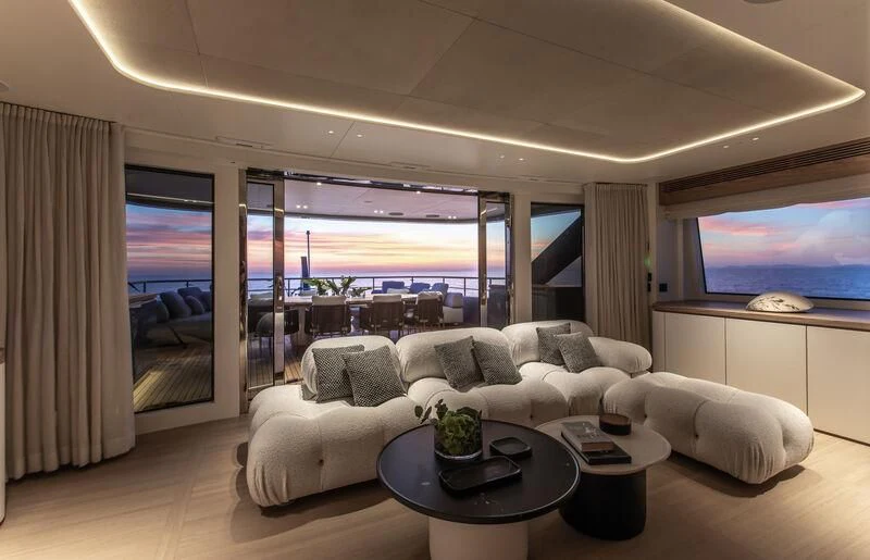 a living room with a large window aboard SEAESTA Yacht for Sale
