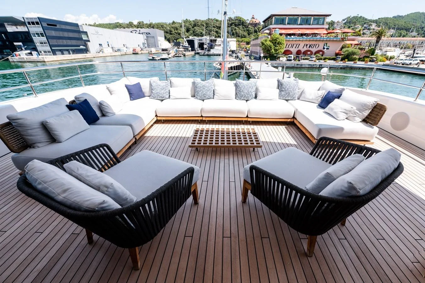 a large living room with a large balcony overlooking a city aboard SEAESTA Yacht for Sale