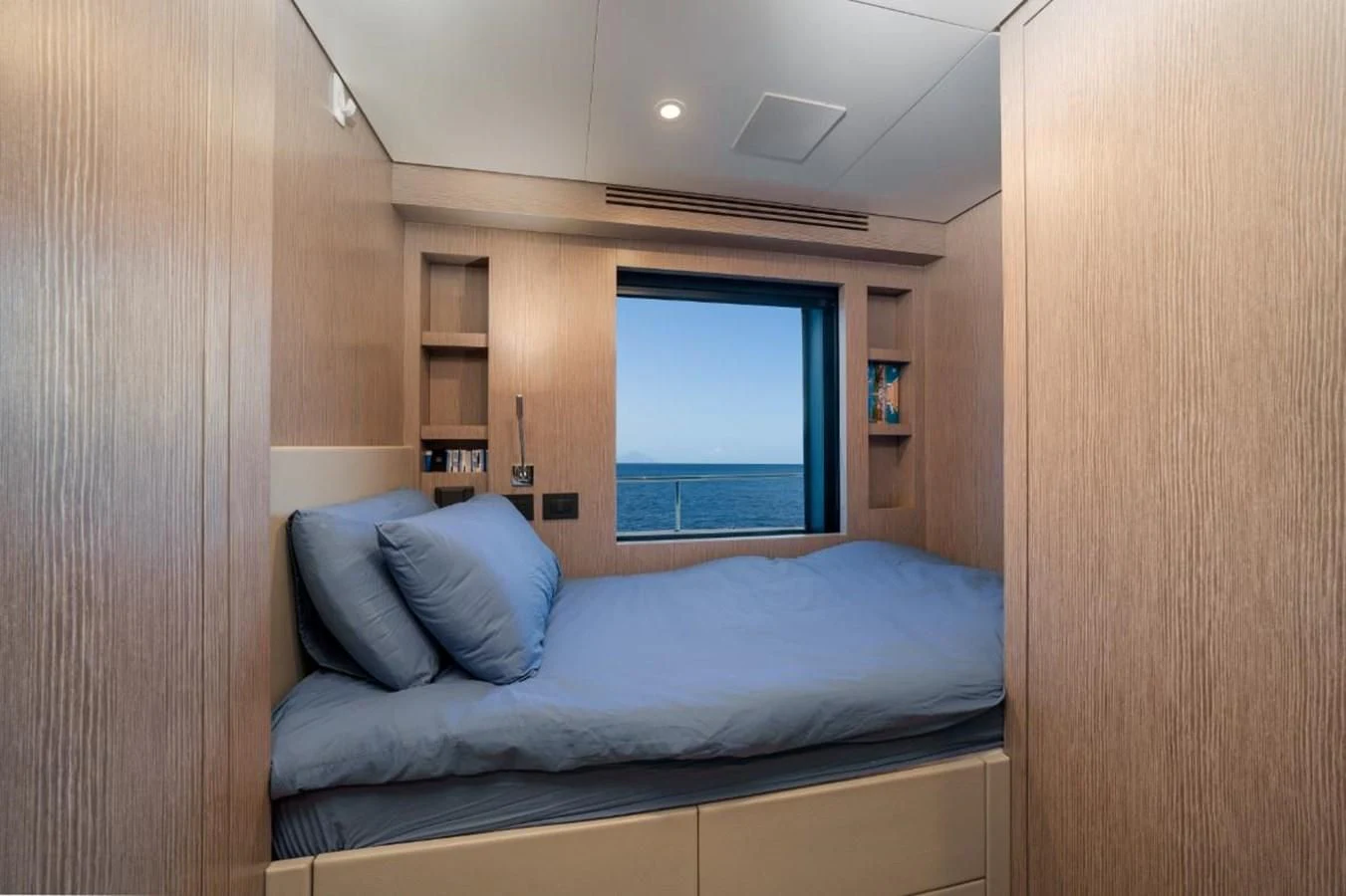 a bed in a room aboard SEAESTA Yacht for Sale