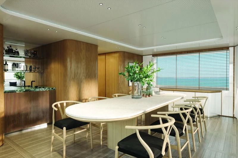 a kitchen with a table and chairs aboard SEAESTA Yacht for Sale