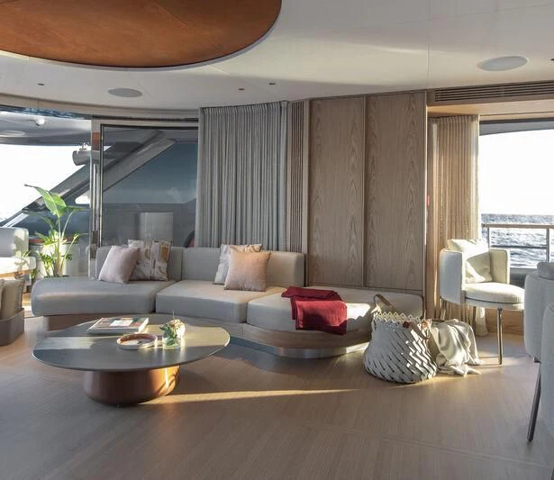 a living room with a couch and a table aboard SEAESTA Yacht for Sale