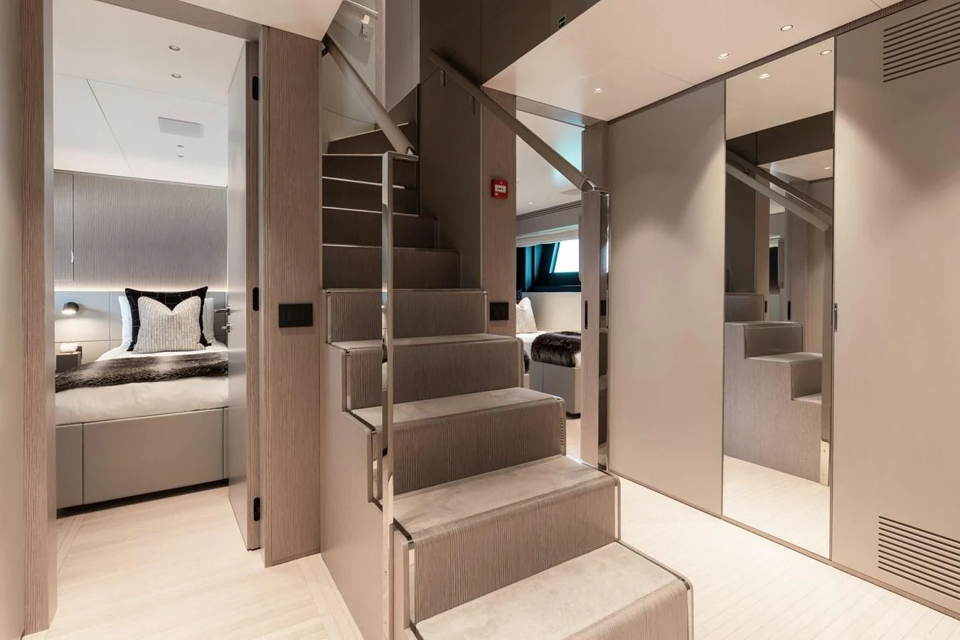 a room with a bed and a staircase aboard SEAESTA Yacht for Sale